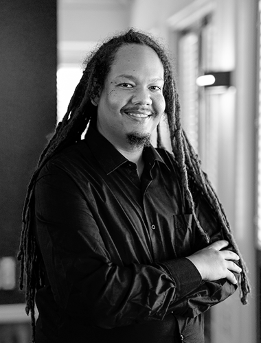 Employee portrait. Drives awareness and equality, fostering intergenerational dialogue for collective commemoration and a future that confronts slavery's legacy.