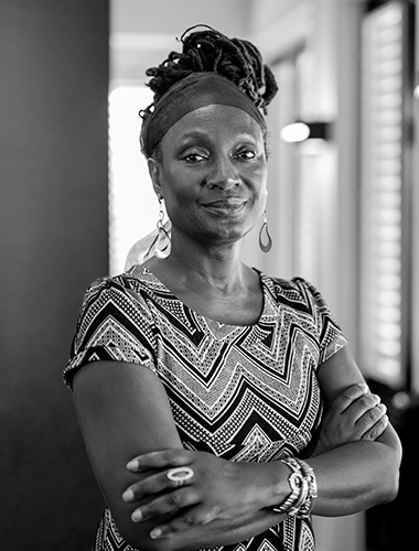 Employee portrait. Envisions a future of equality and awareness through intergenerational dialogue, contributing to collective commemoration that transcends slavery's legacy.