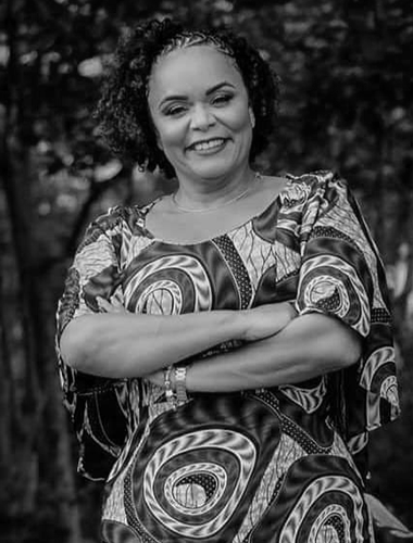 Portrait of an employee supporting awareness, equality, and collective commemoration. Dedicated to building a future beyond slavery's legacy.